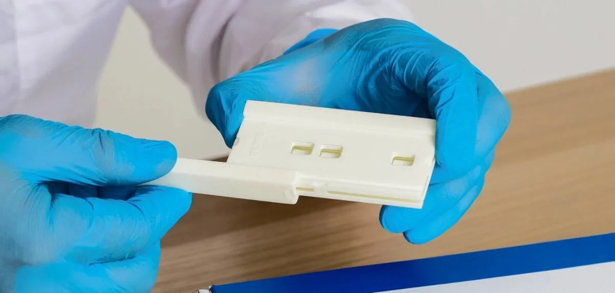 Laboratory specialist works with a biochip on modern equipment