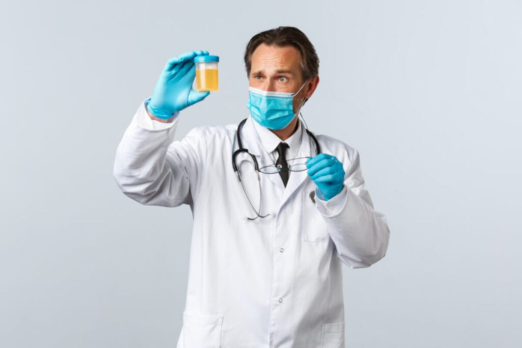 Patient holding a sterile container of urine