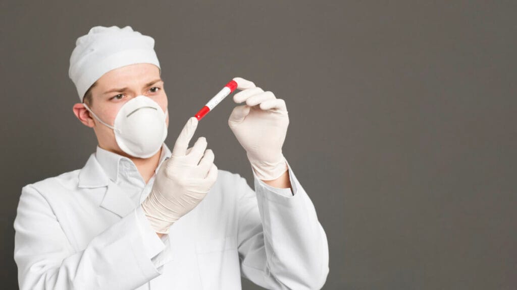 A medical worker performs a rapid test for COVID-19