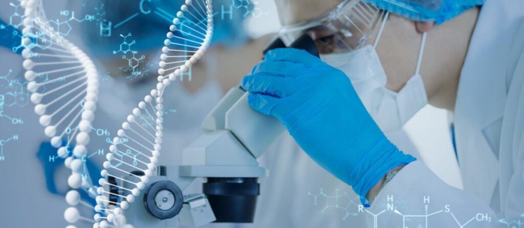 Bioinformatician analyzing DNA sequence data on computer screen
