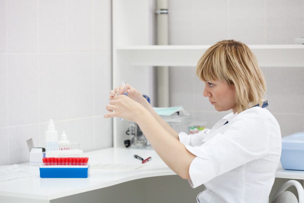 a patient donates blood for TSH in the laboratory