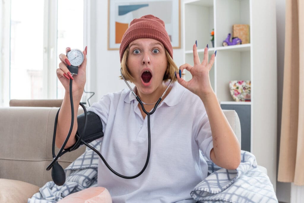 man measures blood pressure after emotional stress