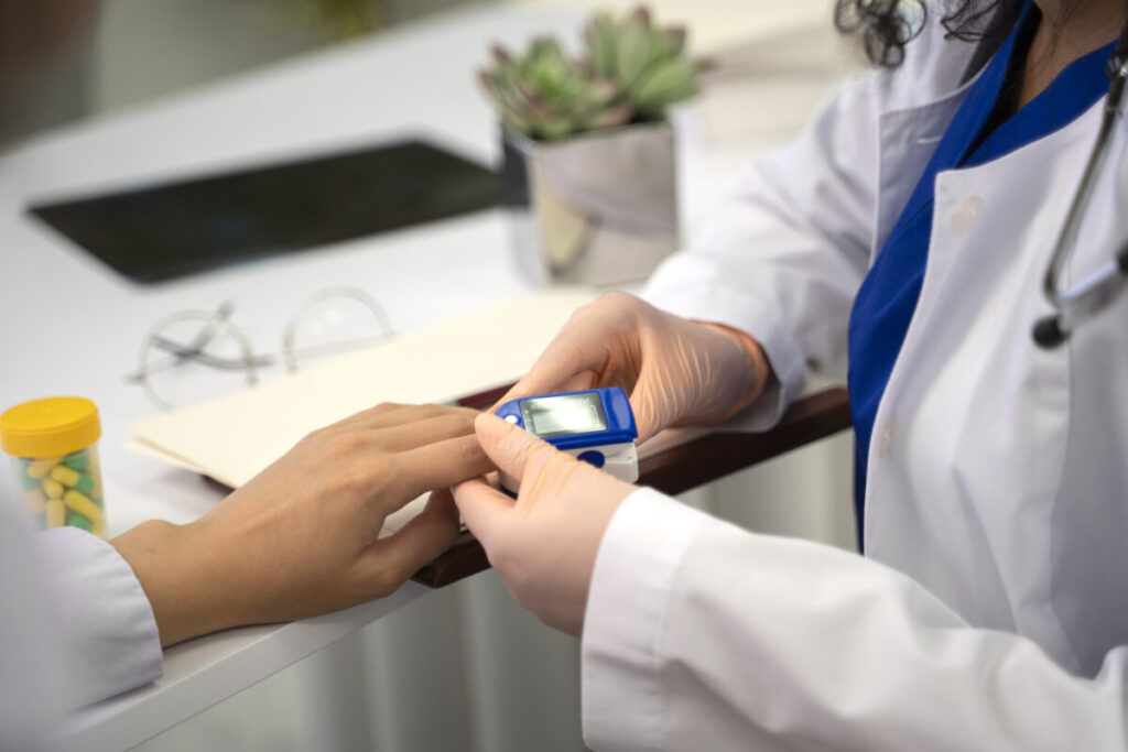 Man checks blood sugar level during stress