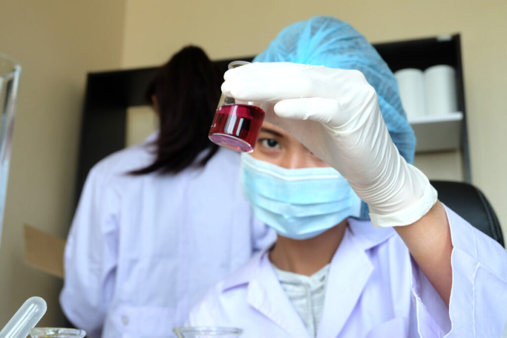 A nurse is taking blood for an hCG test.